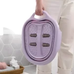 Tina para pies portátil plegable color lila con rodillos masajeadores, ideal para pedicure en casa.