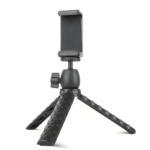 Trípode de escritorio negro con soporte para celular, patas texturizadas y ajuste de ángulo.
