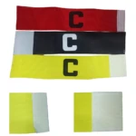 Brazaletes de capitán de fútbol en rojo, negro y amarillo, con letra "C" en contraste y velcro. Incluye detalle de dos brazaletes amarillos.
