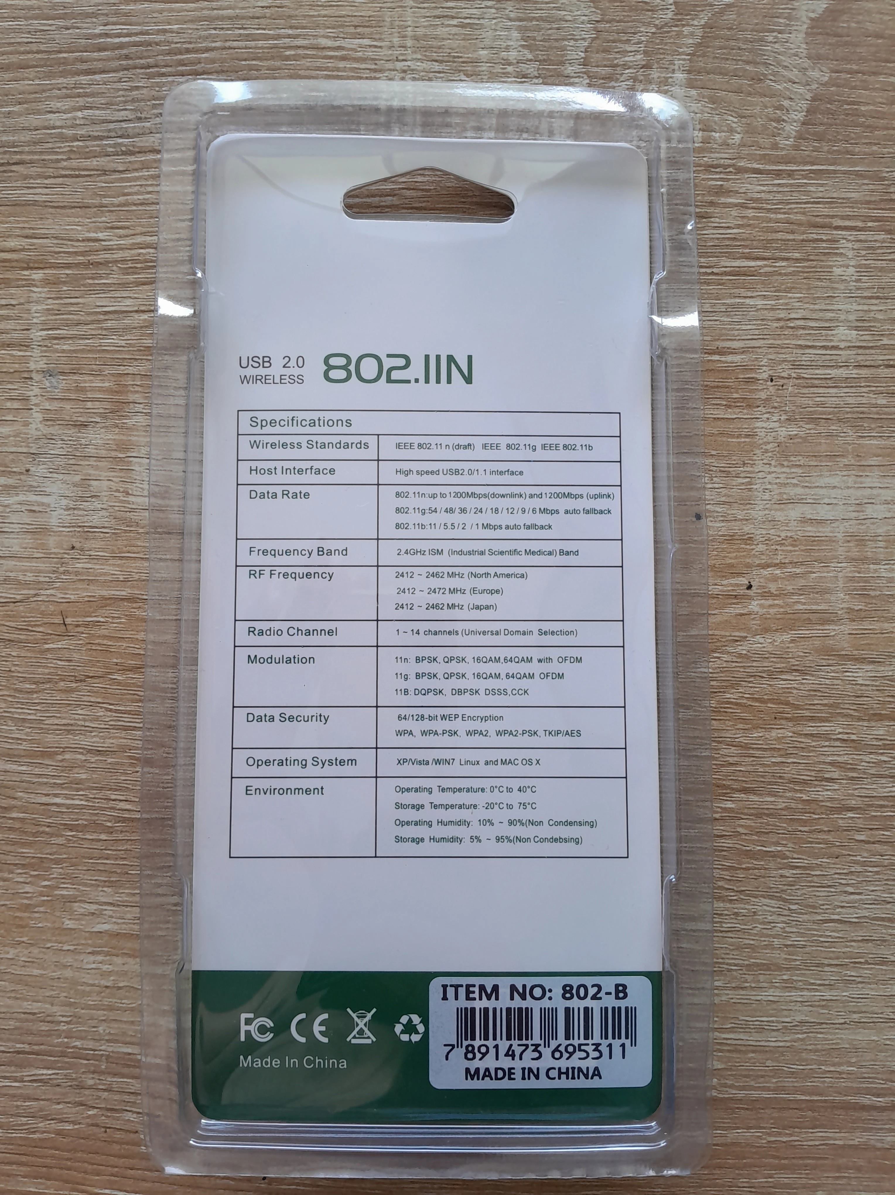 Adaptador Wifi USB 802.11n para computadora, con especificaciones técnicas detalladas en su empaque.