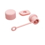 Kit antiderrame Stanley rosado: tapón cilíndrico, sello ovalado y boquilla con asa.