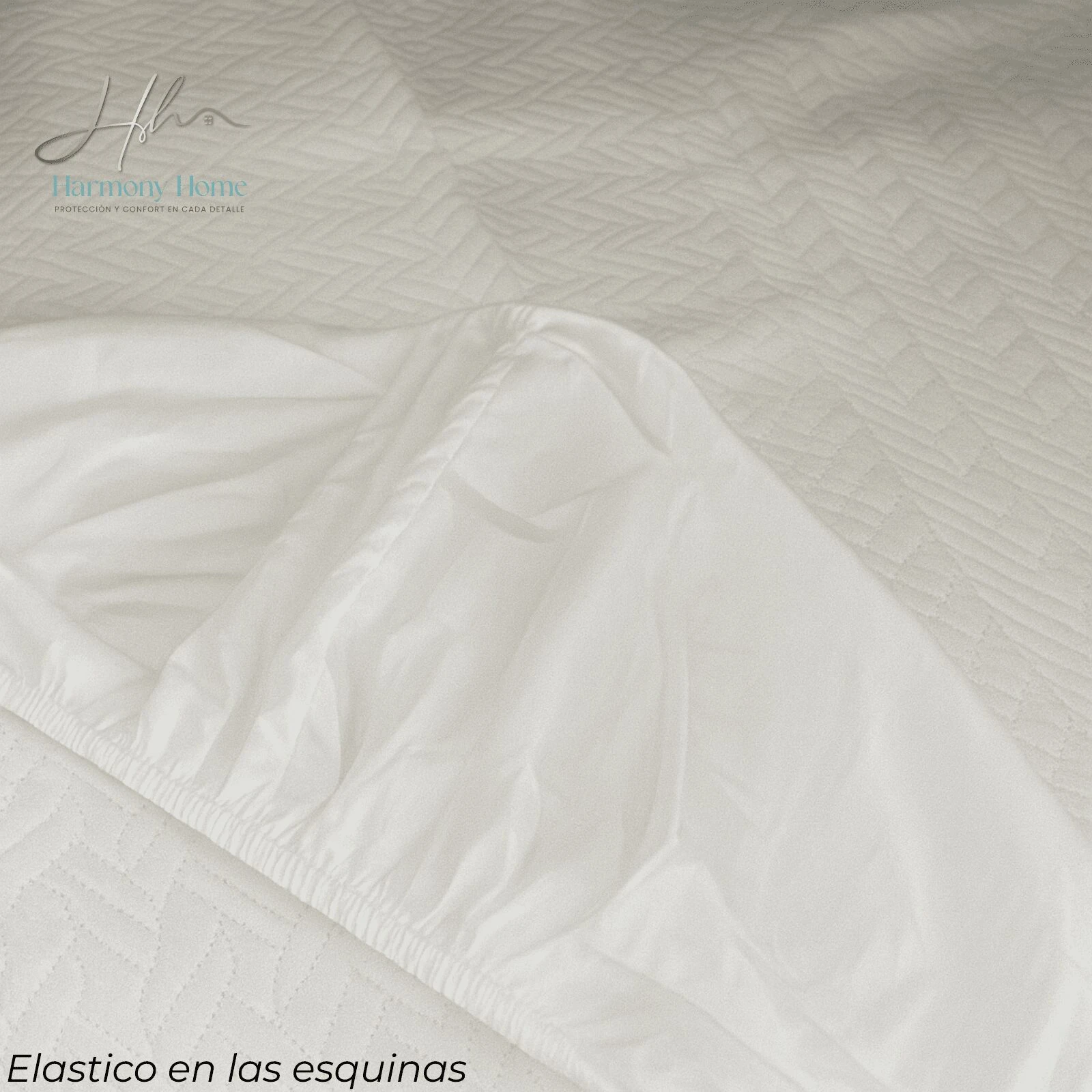 Protector colchón blanco con textura de rombos y elástico en las esquinas para ajuste seguro.