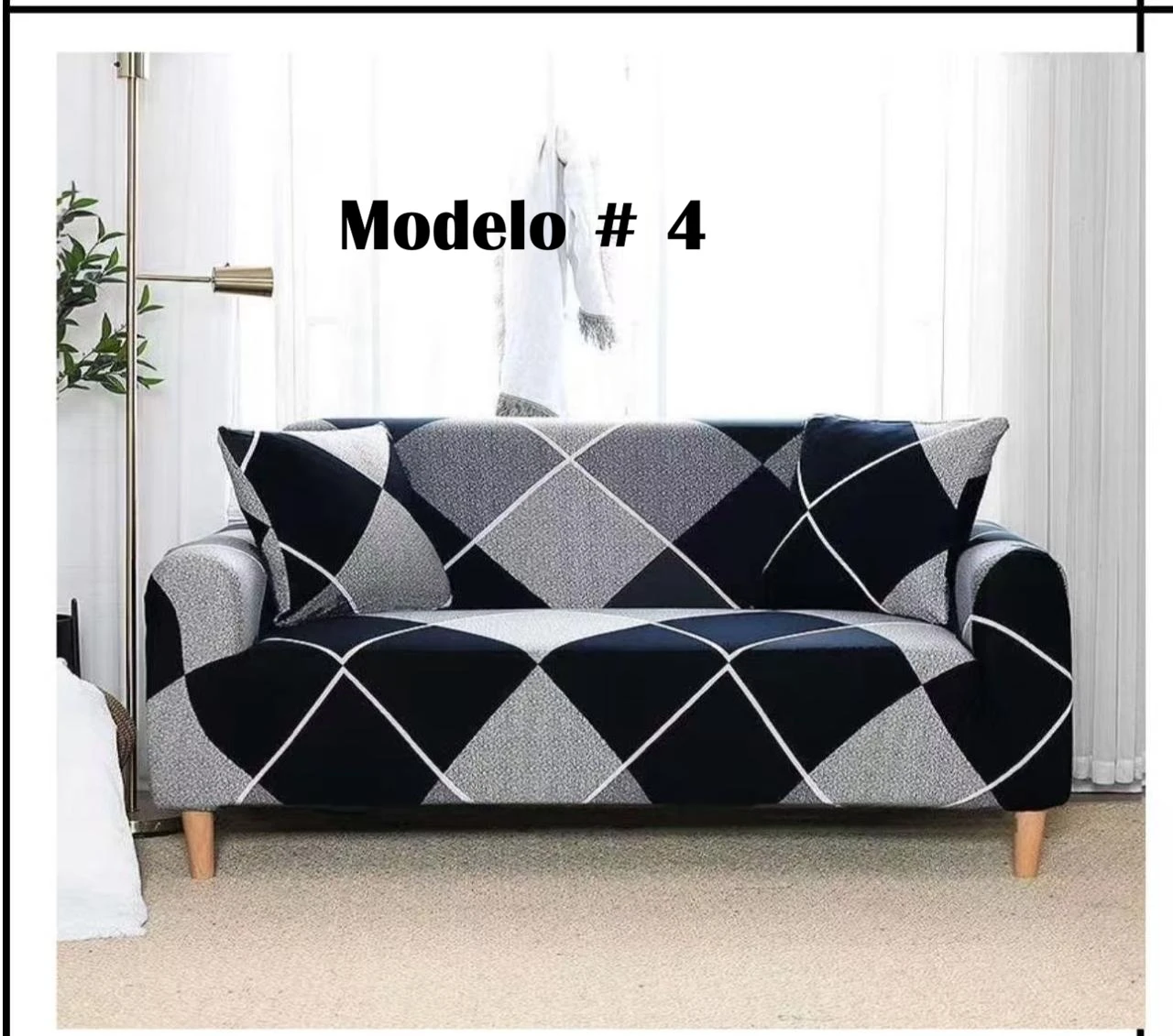Funda elástica protectora para sofá en diseño de rombos con tonos negro, gris y blanco, vista frontal completa.