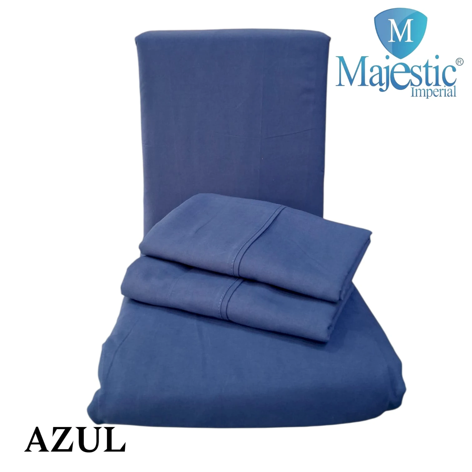 Sábanas cama sencilla unicolor azul de Majestic Imperial, presentadas con sábanas dobladas y funda de almohada, mostrando textura suave y acabado uniforme.