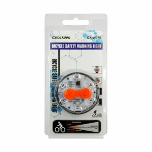 Luz trasera para bicicleta marca QIXUN modelo QX-W07B en su empaque. Diseño circular con carcasa plateada y lente central naranja brillante. Incluye LEDs visibles.