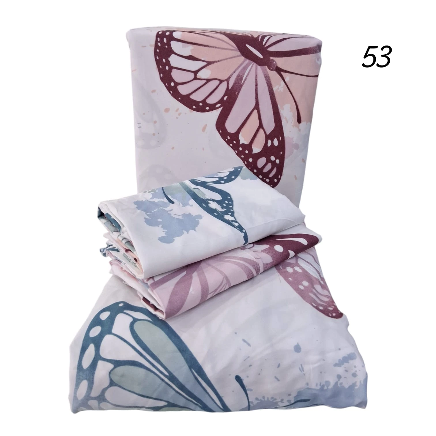 Set de tres sábanas microfibra con estampado de mariposas en tonos rosa, azul y lila, presentadas apiladas sobre fondo blanco.