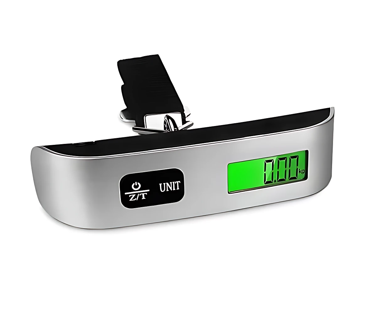 Báscula digital portátil con carcasa plateada y banda negra. Pantalla LCD verde y botones de control visibles. Muestra 0.00 kg.
