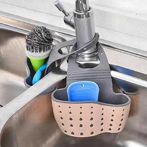 Set de 2 canastas escurridoras para fregadero, una beige y otra gris, para organizar utensilios de limpieza y esponjas cerca del grifo.
