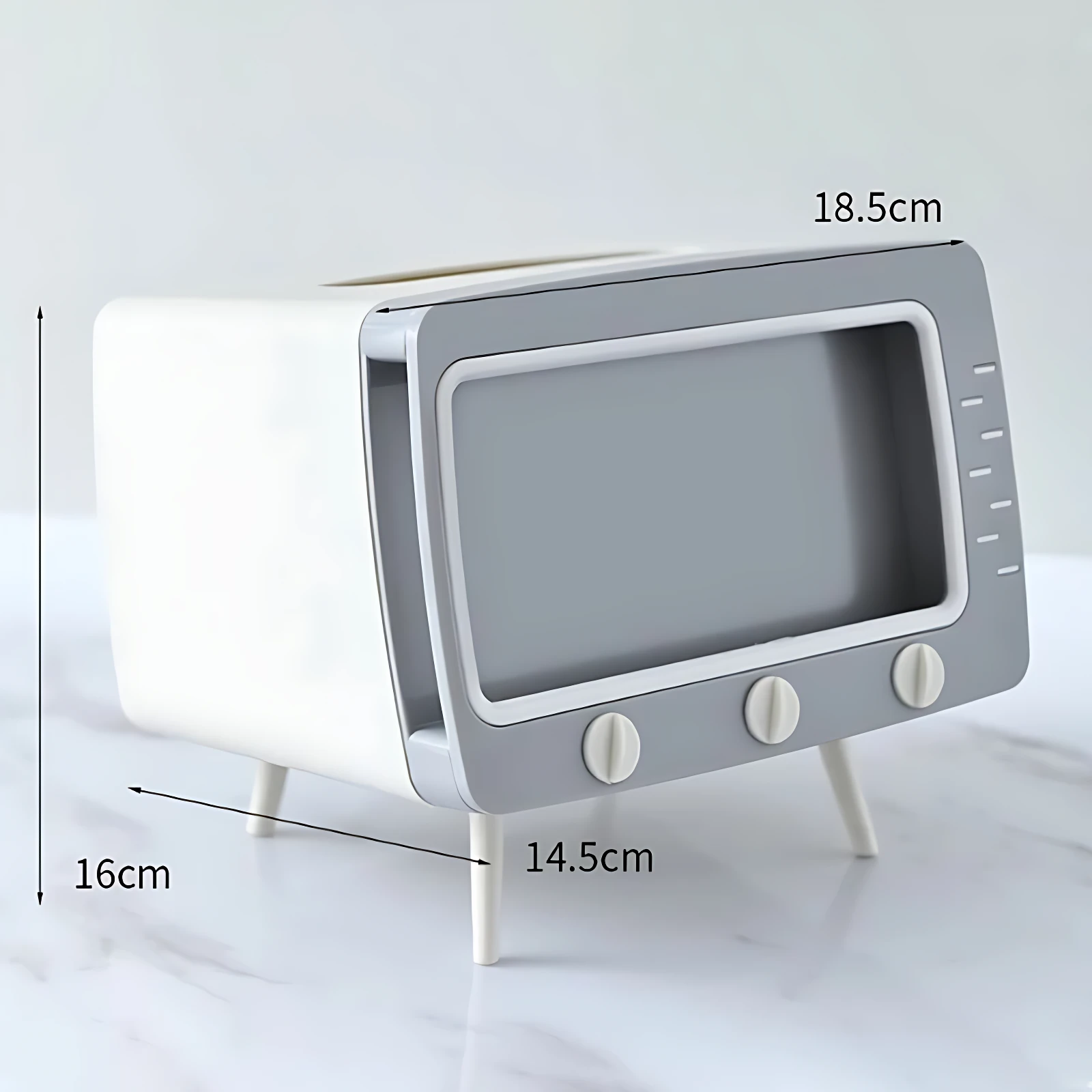 Dispensador de servilletas blanco y gris con forma de TV antigua, 18.5cm ancho, 16cm alto, 14.5cm profundidad.