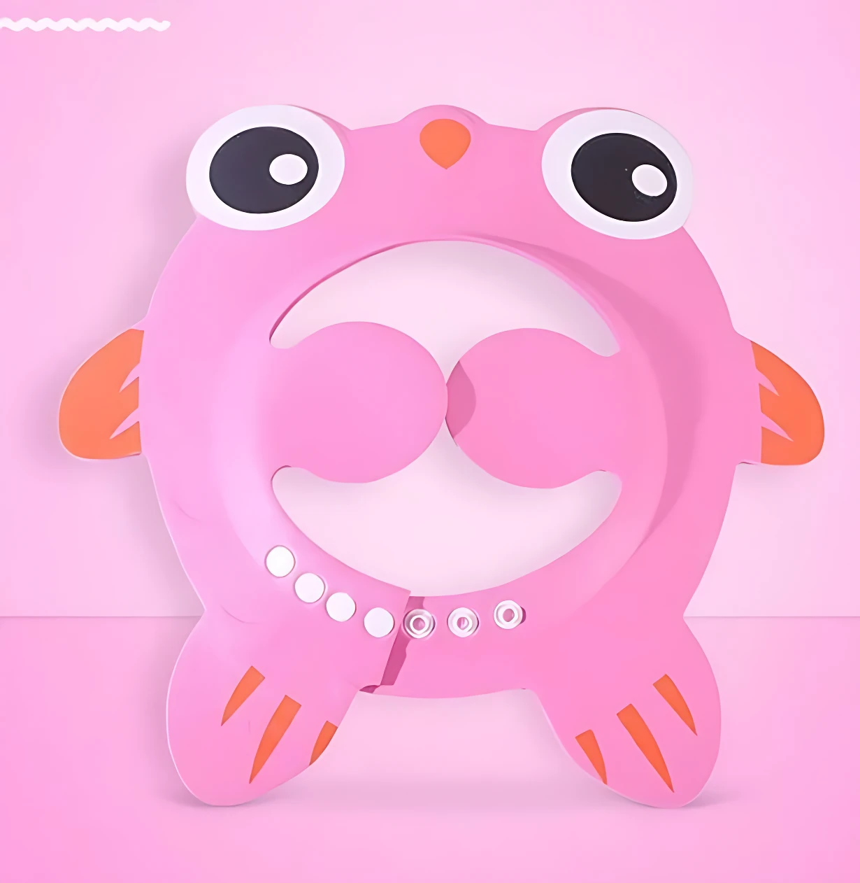 Gorro de baño infantil rosa con diseño de ranita, ojos grandes y boca abierta, incluye detalles en naranja y perlas blancas.