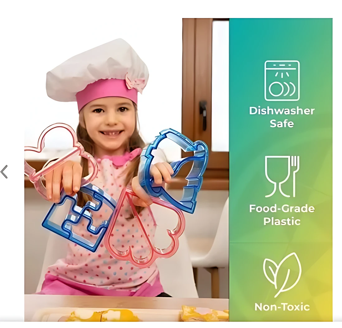 Niña sonriente con gorro de chef sosteniendo moldes de silicona en colores rosa y azul, diseñados para hacer figuras de comida en loncheras.