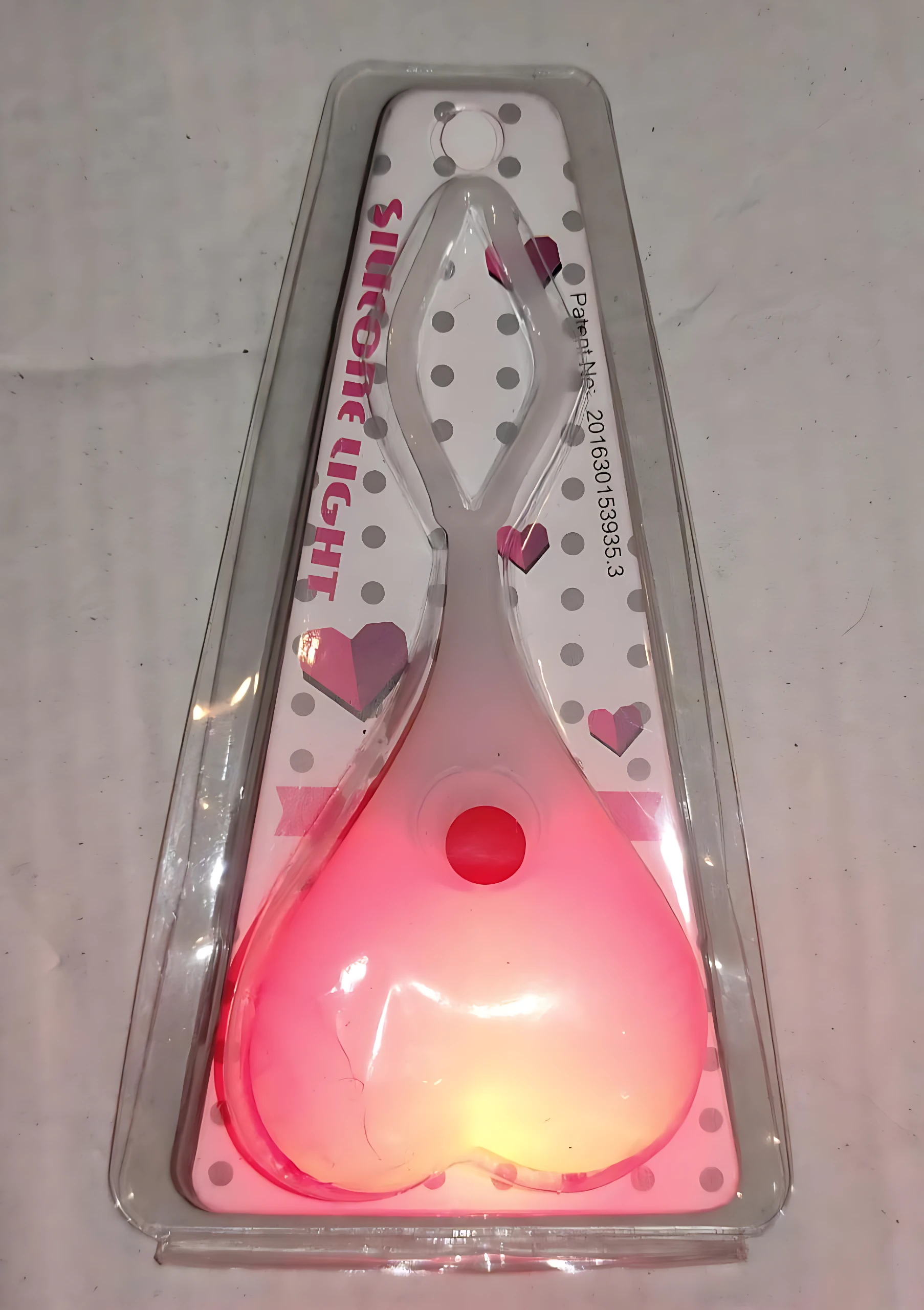 Luces LED para bicicleta en forma de corazón, color rosa, con patrón de puntos y texto "Silicone Light".
