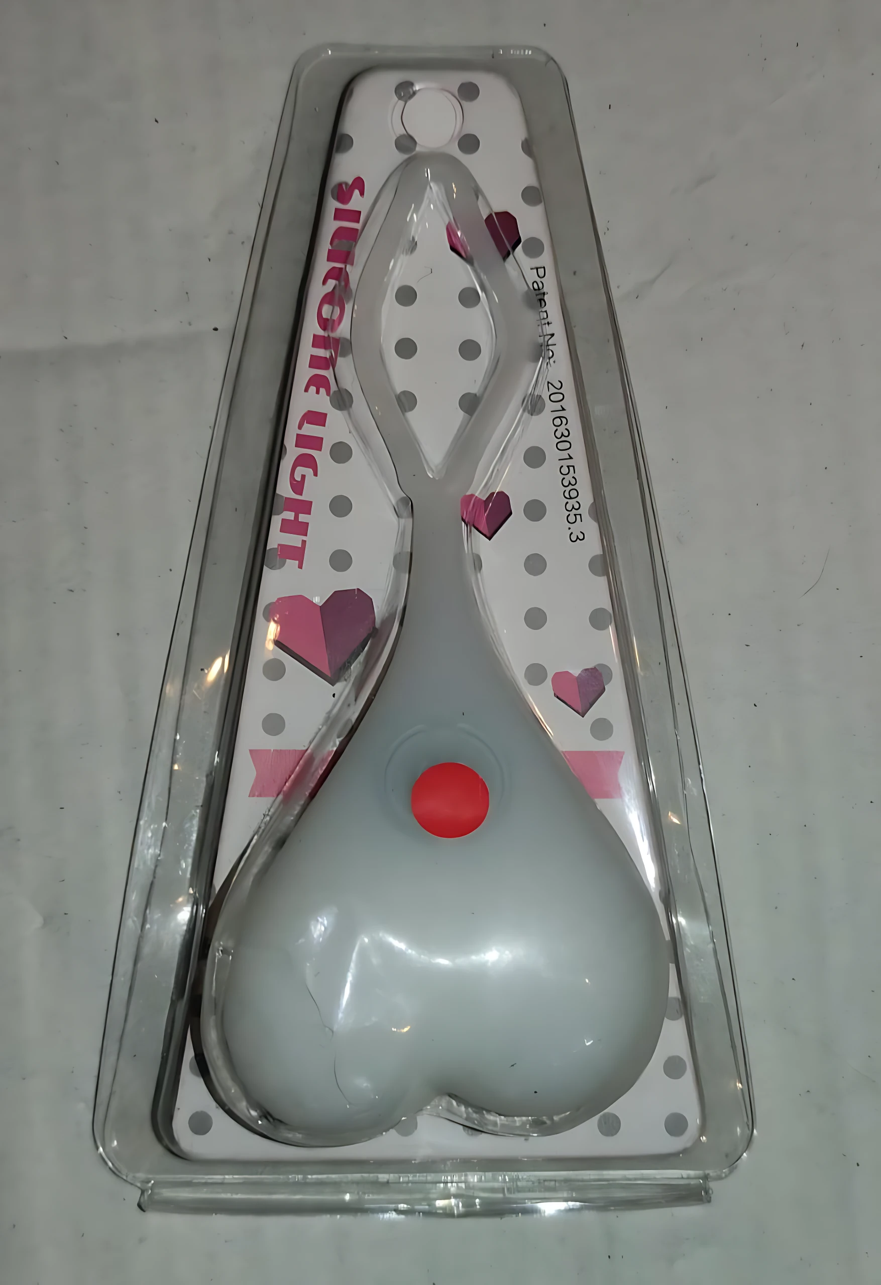 Luces LED para bicicleta en forma de corazón, blancas con botón rojo, en empaque plástico.