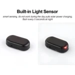 Dispositivo antirrobo solar negro con sensor de luz, mostrando vista frontal y lateral con indicador LED rojo encendido.