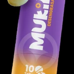 Envase cilíndrico de Mukin Desengrasante con degradado morado a naranja. Muestra la indicación "10 Tabs" y dos tabletas efervescentes verdes flotando a los lados.