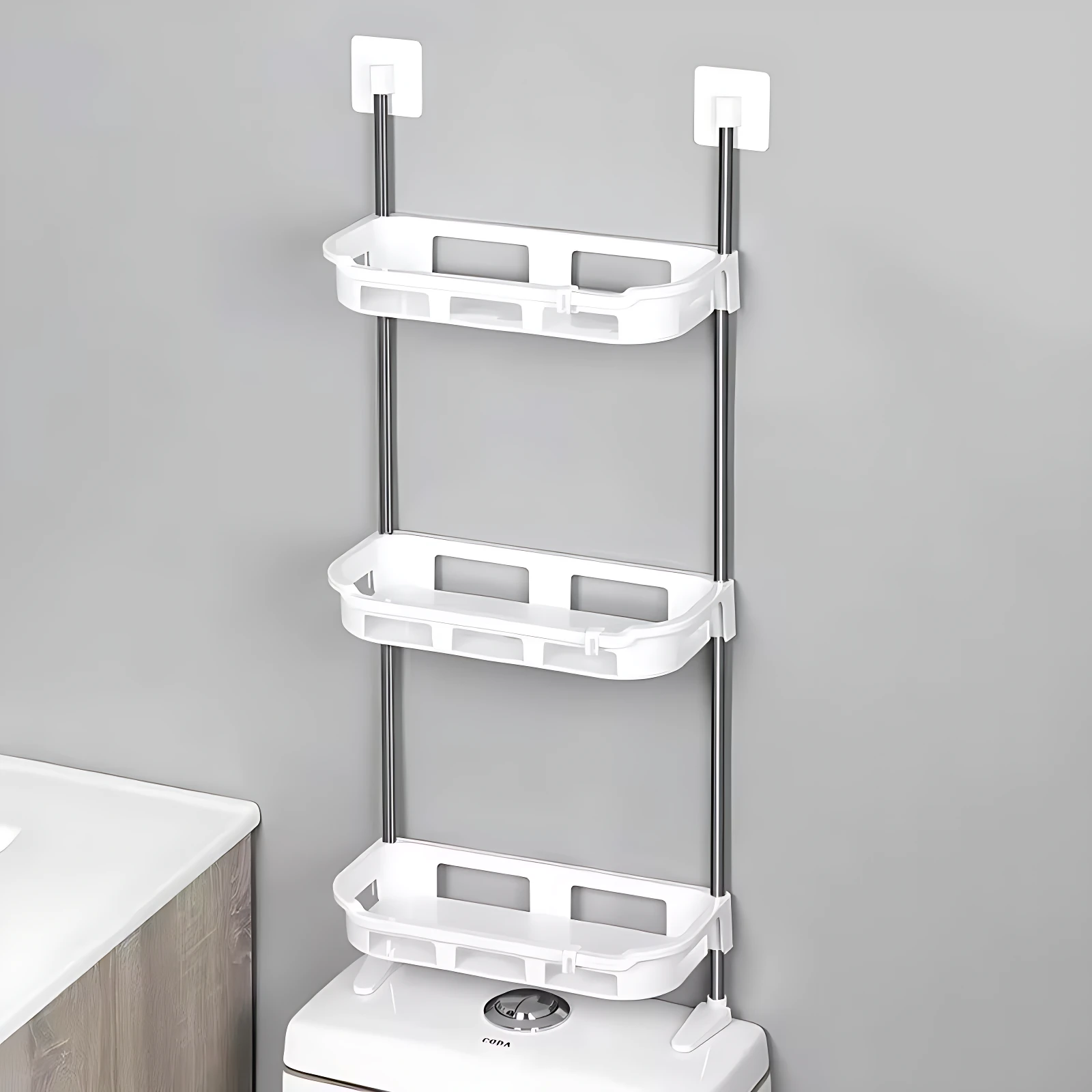 Organizador de baño vertical de tres niveles, color blanco, con estantes plásticos y soportes metálicos, montado sobre inodoro.