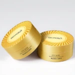 Set x2 parches para ojeras Bioaqua en envase dorado con diseño de rayos, ideales para revitalizar e hidratar el contorno ocular.