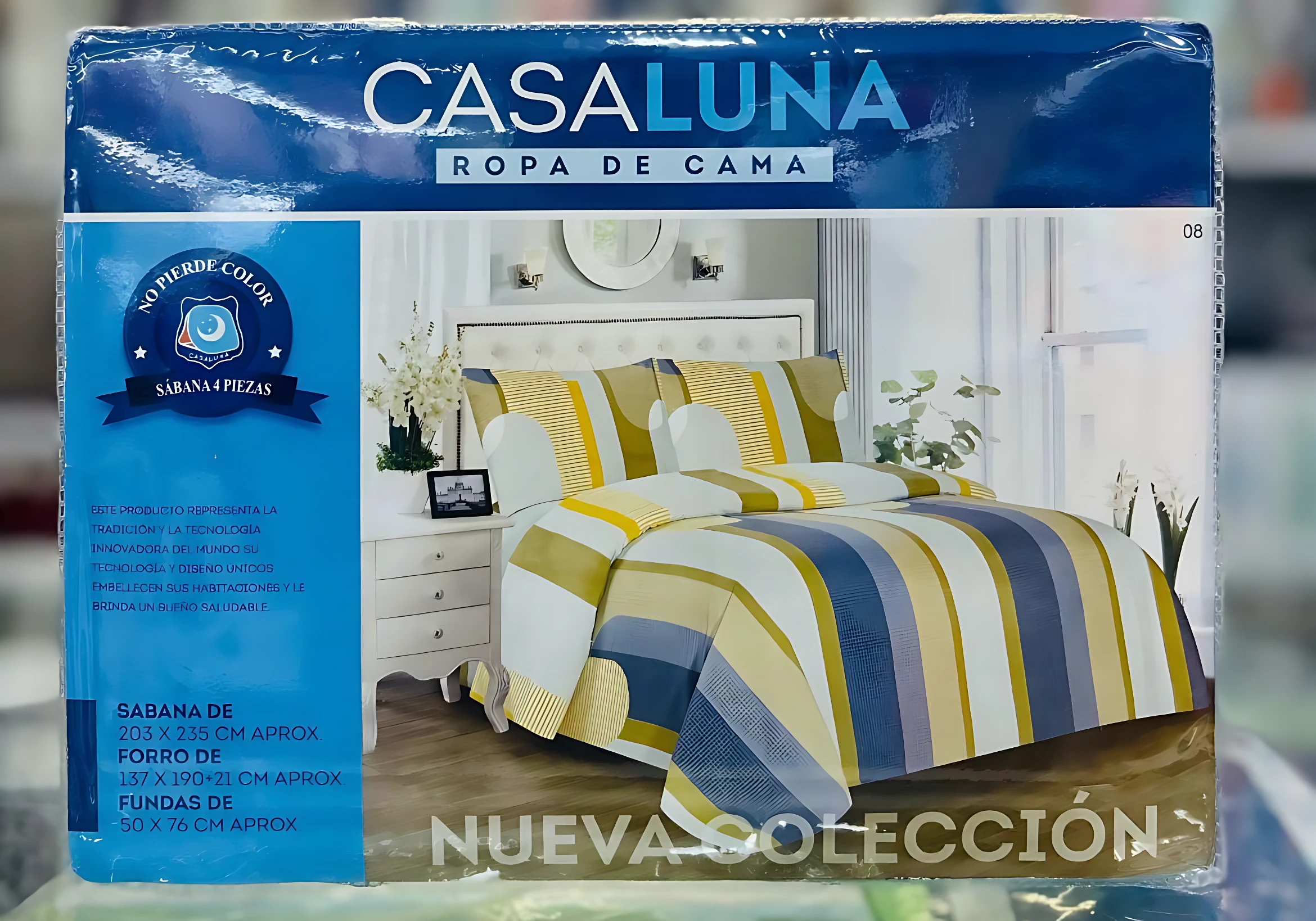 Paquete de juego de sábanas Casaluna para cama sencilla con estampado de rayas en azul, amarillo y blanco. La caja muestra medidas de sábana 203 x 235 cm y es un set de 4 piezas.