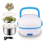 Calentador eléctrico Sethruki con tapa azul, contenedores metálicos para arroz y vegetales, cable de alimentación y huevos decorativos en la parte superior.