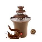 Fuente de chocolate eléctrica mini con cascada continua, color marrón, incluye bola de chocolate y salpicadura decorativa.