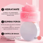 Tubo de crema rosa con tapa blanca, mostrando textura cremosa en la parte superior. Etiqueta con nombre Hunmui y beneficios: hidratación, eliminación de poros y control de grasa. Fondo rosa claro con texto descriptivo.