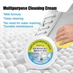 Limpiador de zapatos en crema, presentación circular con etiqueta multilingüe. Se aplica con esponja amarilla sobre zapatilla blanca de cordones, sobre fondo de espuma blanca texturizada.