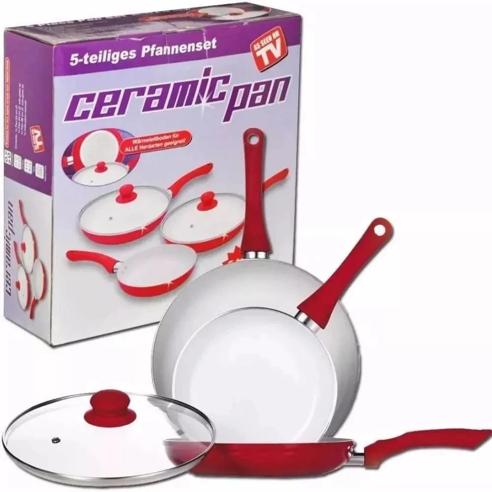 Sartén cerámica antiadherente con mango rojo, junto a su caja que muestra el set completo de cinco piezas. Incluye tapa de vidrio y sartén plana.
