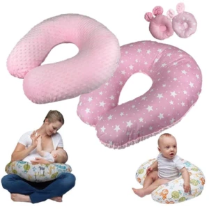 Cojín ergonómico en forma de dona, color rosa con estampado de estrellas y textura suave. Incluye dos almohadillas pequeñas. Se muestra en uso: madre amamantando y bebé sentado sobre él.