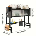 Platillera escurridora de aluminio negro con tapa protectora, medidas 84x31x81 cm, incluye estantes para utensilios y platos.