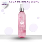 Botella de 250 ml de agua de rosas Sagu en tono rosa con etiqueta blanca y logotipo central, presentada sobre fondo claro con burbujas decorativas.