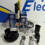 Licuadora inmersión ICM 800W acero inoxidable con accesorios: vaso, procesador, batidor y cuchillas, sobre fondo blanco con caja azul.
