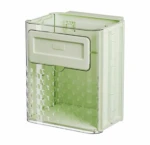 Basurero plegable verde claro con tapa frontal y rejilla decorativa, diseñado para instalación en puertas de gabinete.