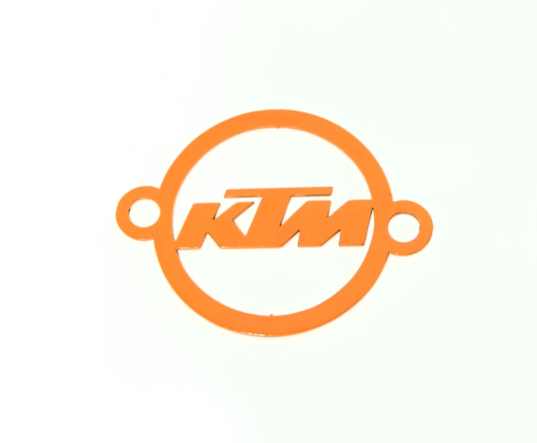 Tapa filtro aceite KTM acero inoxidable con acabado brillante, diseño circular con logotipo naranja y orificios laterales para instalación.