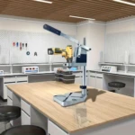 Soporte guía para taladro amarillo y azul sobre mesa de trabajo en laboratorio, con mandril ajustable y regla de profundidad visible.