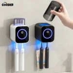 Dos esterilizadores automáticos de cepillos de pared, uno blanco y otro negro, con luces azules activas y cepillos eléctricos colgando; se muestra la tapa removible del modelo negro.