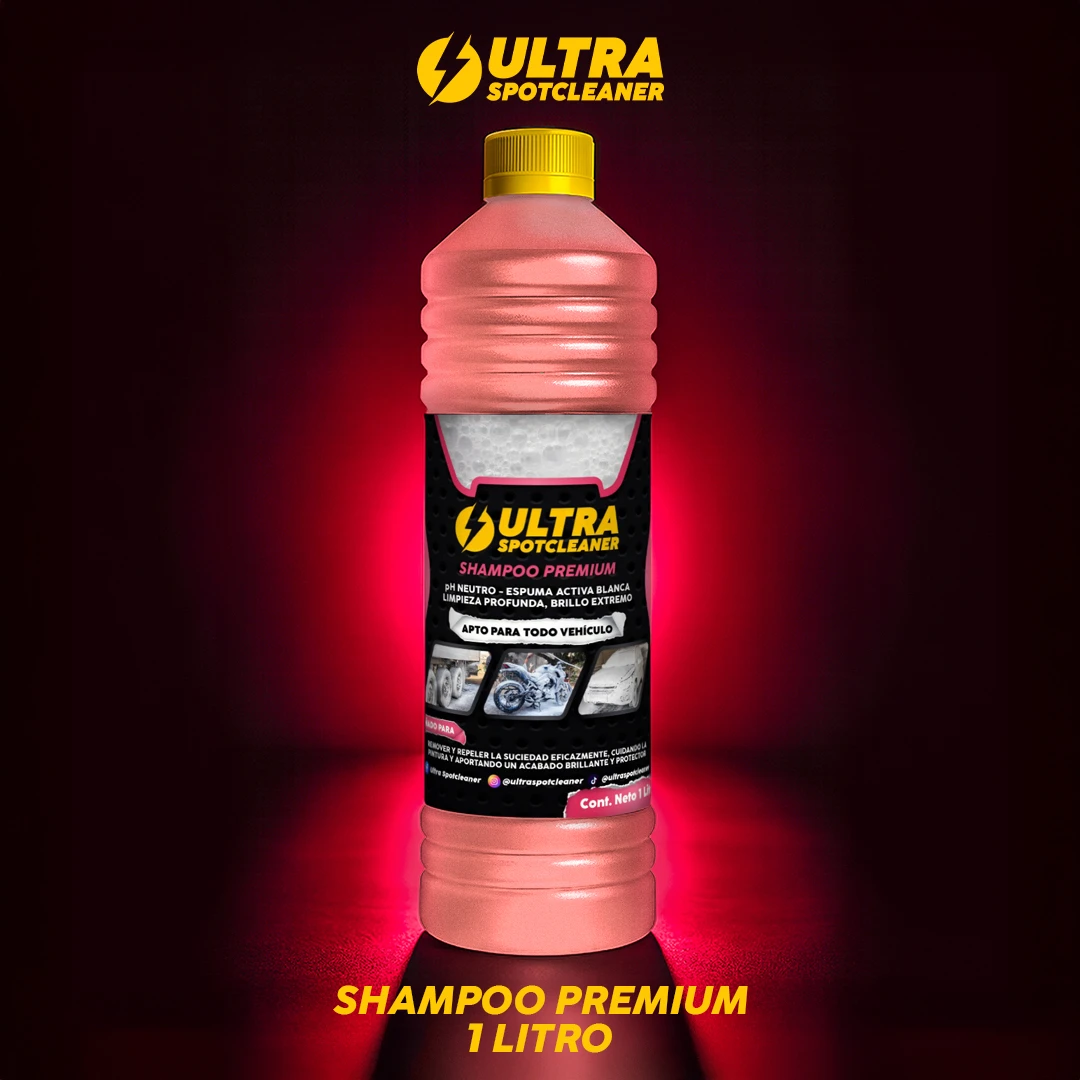 Botella de 1 litro de shampoo premium Ultra Spotcleaner en tono rosado con tapa amarilla, sobre fondo oscuro con iluminación roja. Etiqueta frontal con imágenes de limpieza de vehículos.