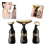 Masajeador facial 3 en 1 con calor, cabezas intercambiables doradas y negro, incluye estuche de regalo y accesorios.