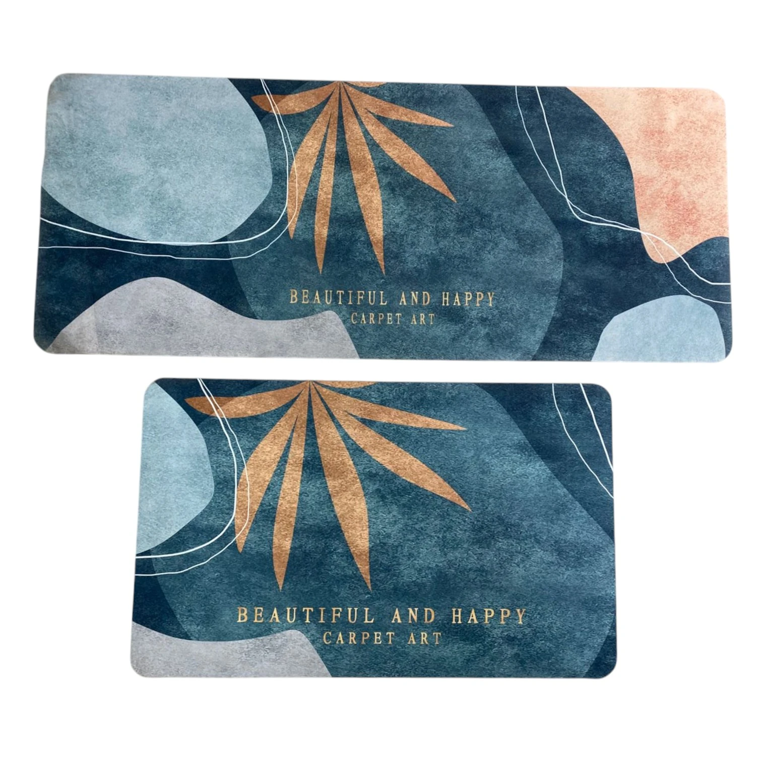 Tapete rectangular antideslizante con diseño geométrico en tonos azul, beige y rosa, con hojas doradas y texto "Beautiful and Happy Carpet Art".