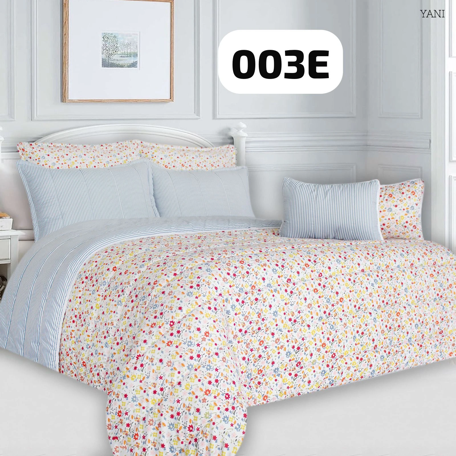 Plumón estampado floral en tonos pastel sobre cama con cabecero blanco y cojines a juego, vista frontal completa.