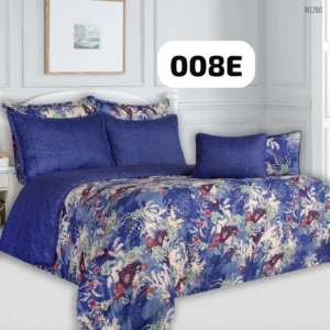 Plumón floral azul con cojines combinados, diseño elegante para cama doble, ideal para renovar tu descanso con confort inmediato.