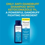 Champú medicado Nizoral con ketoconazol al 1%, presentación de 14 oz, envase azul con etiqueta blanca y texto en amarillo y negro, sobre fondo azul sólido.
