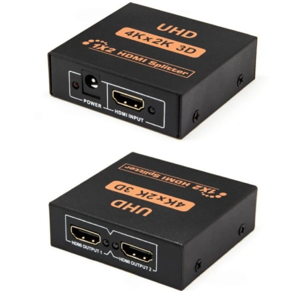 Adaptador HDMI 1x2 activo en caja negra, mostrando puerto de entrada y dos salidas, con etiquetas UHD 4Kx2K 3D.