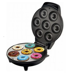 Máquina Donera X 7 con placas antiadherentes, mostrando siete mini donas horneadas en colores variados sobre la base inferior.