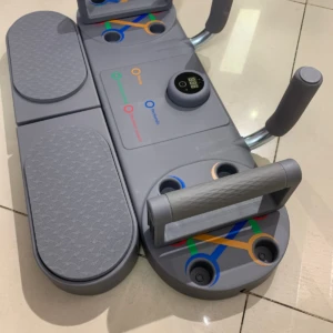 Tablero de flexiones gris A1 con manijas ergonómicas, contador digital y correas elásticas integradas para entrenamiento completo.