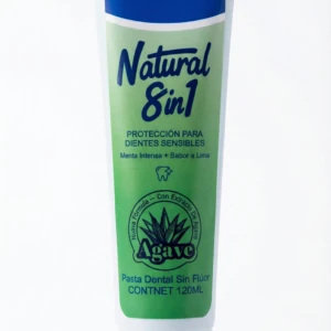Tubo de pasta dental Occotaps Natural 8 en 1 para dientes sensibles, con etiqueta verde y azul, diseño vertical, presentación de 120 ml.