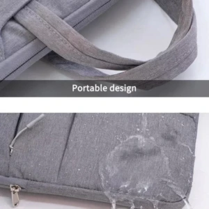 Maletín gris acolchado para laptop de 13 a 17 pulgadas, con asa portátil y superficie repelente al agua.