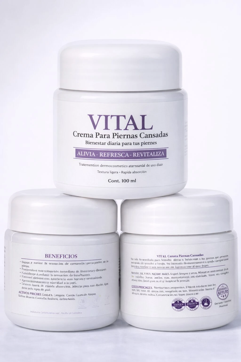 Tres frascos blancos de crema Vital para piernas cansadas, uno encima de dos, con etiqueta que indica 100 ml y beneficios visibles.