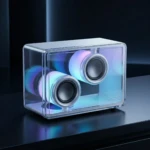 Altavoz portátil Crystal BT 5.3 con carcasa acrílica transparente, mostrando vibración de drivers en tiempo real con luces RGB azules y moradas.