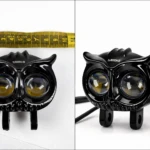 Par exploradora Buo dual color 40W LED en negro, vista frontal con dos lentes amarillas y negras, acompañado de cinta métrica para referencia de tamaño.