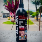 Botella negra de spray con etiqueta que dice A-T-I-M Multi Purpose, biodegradable, para desengrasar, desinfectar, limpiar, brillar y proteger superficies automotrices.